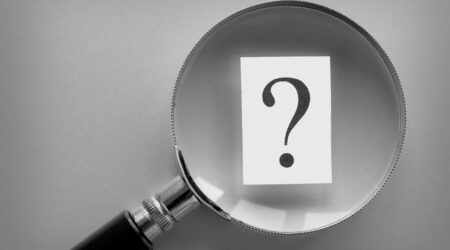 question mark under magnifying glass